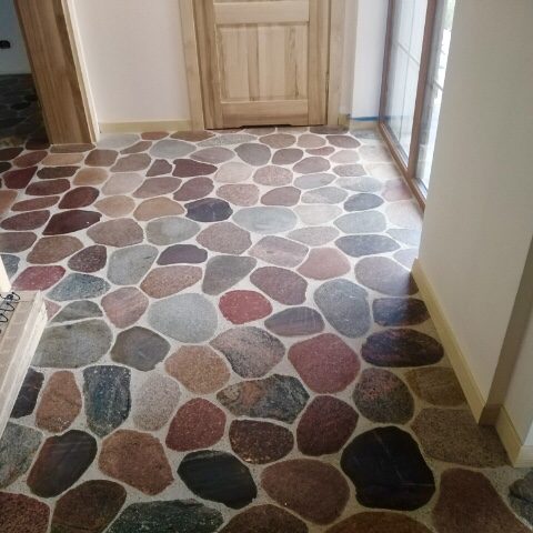 Cut field stone flooring. Modern interior design. 